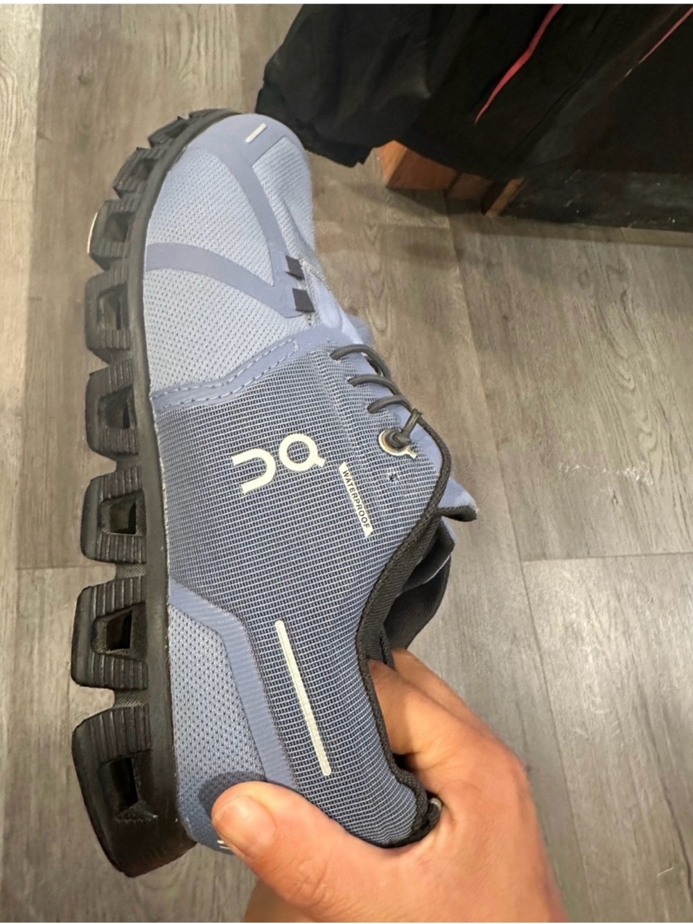 On Running Women’s Cloud Trail Sneaker in Light Blue with Black Sole